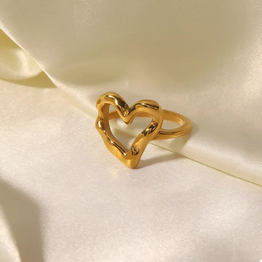 18K gold-plated heart ring on white satin background