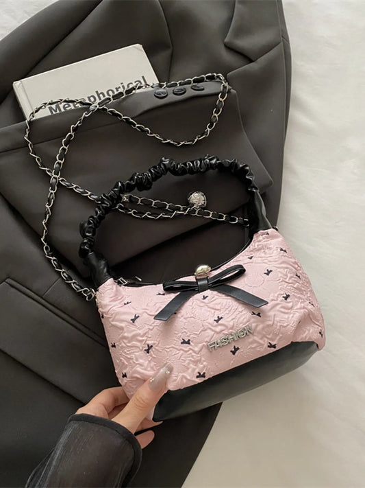 Small pink Bow Ruched Strap crossbody bag with chain and ruched handles made of PU leather and polyester